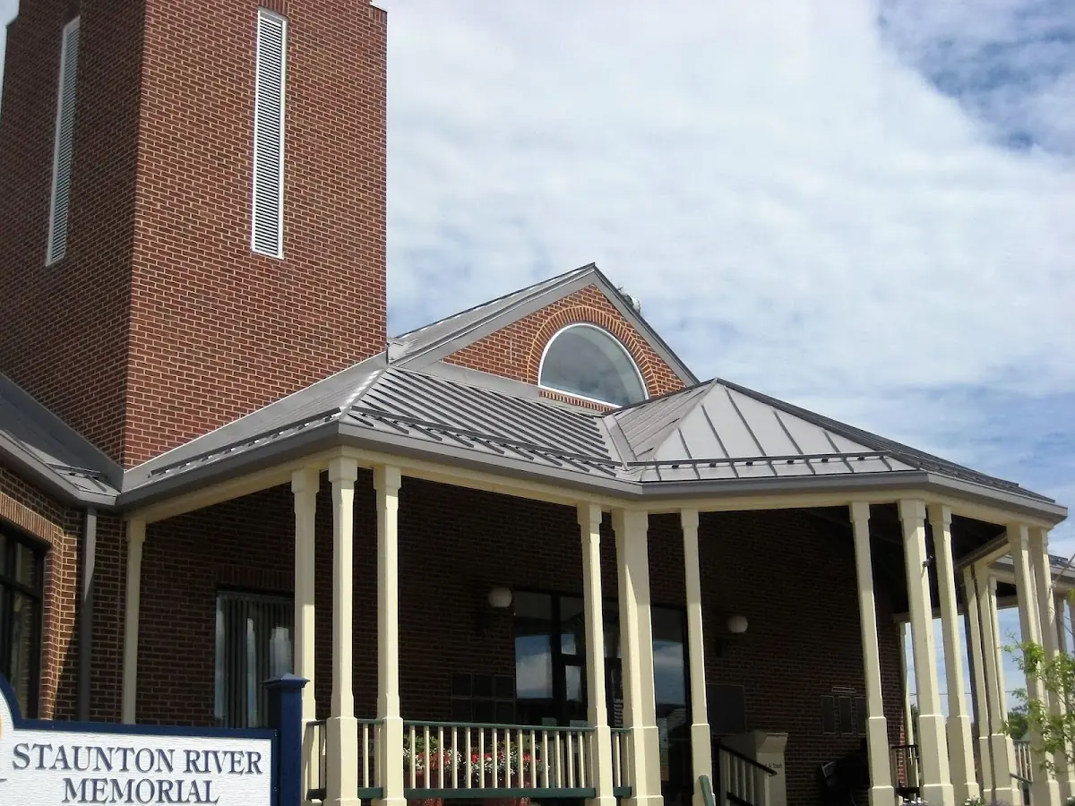 Skilled roofing craftsmen working on a residential roof in Campus Heights